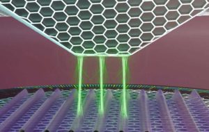 Schéma en gros plan du microscope à torsion quantique en action. Les électrons passent par effet tunnel de la sonde (pyramide inversée en haut) à l'échantillon (en bas) en plusieurs endroits à la fois (lignes verticales vertes), de manière cohérente au niveau quantique.